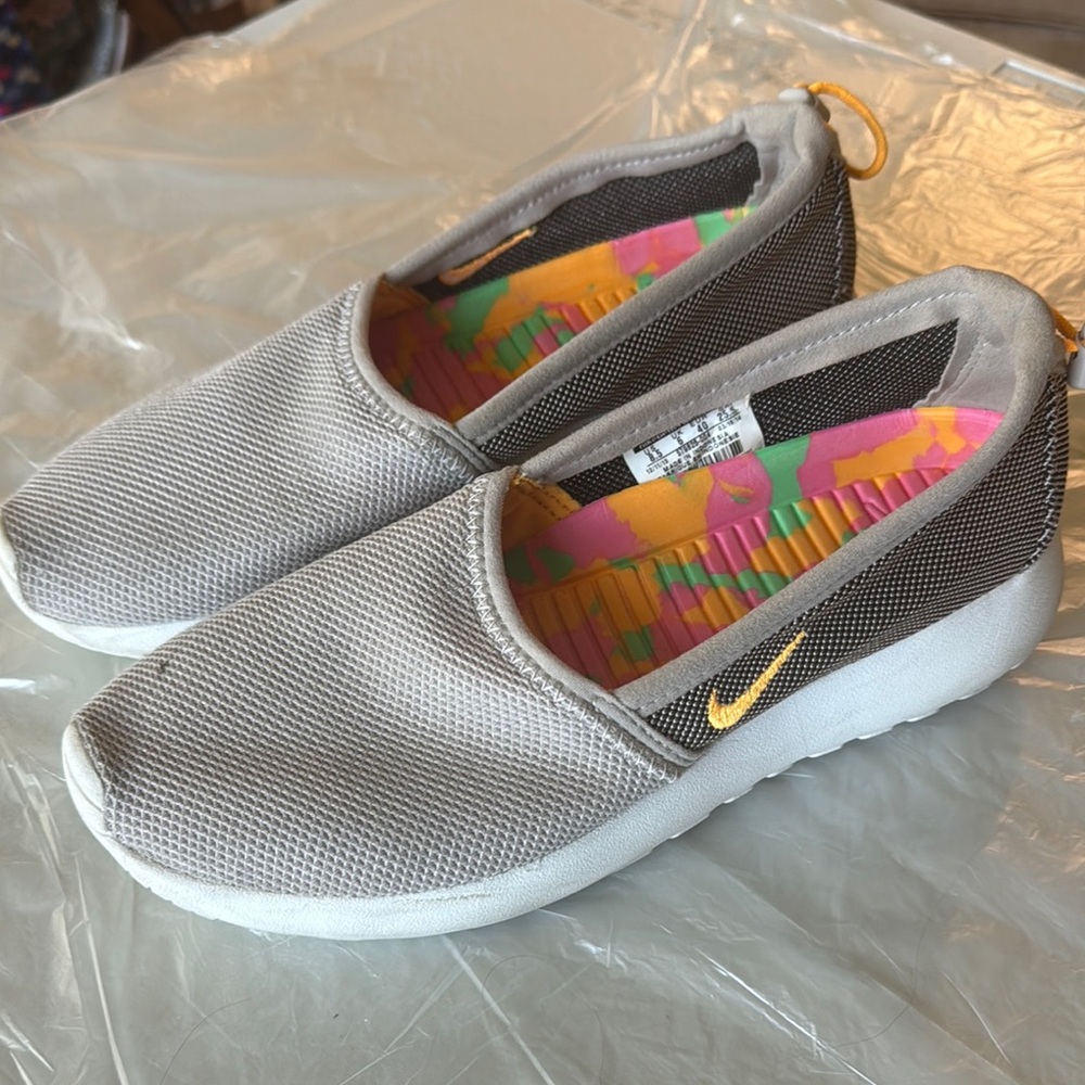 Nike Gray and White Slip-On Shoes with Gold Swoosh